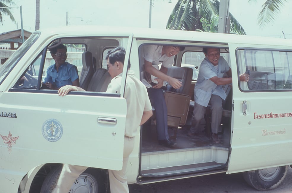 During 1983, a van from Thai Ministry of Public Health transports FETP trainees to investigate an outbreak of diphtheria in Samut Prakan province, just outside of Bangkok. Photo: Bruce G. Weniger, MD, MPH; CAPT, USPHS/CDC (ret.)