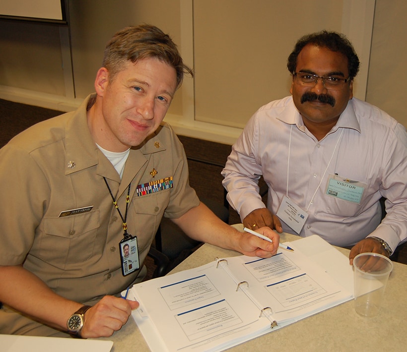 David Sugerman (left) mentoring India EIS Officer Dundaiah Somashekar at the 2015 Global FETP NCD Workshop. 