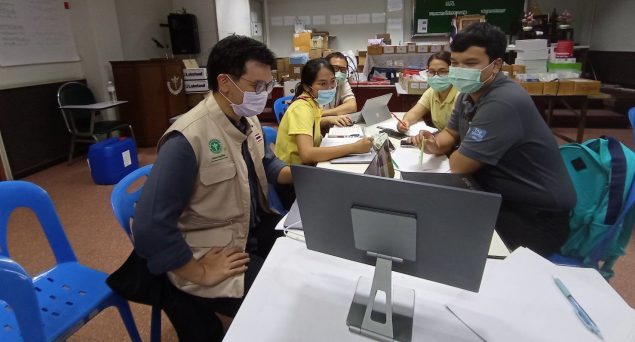 Dr. Ern and the Department of Disease Control Thailand healthcare personnel discuss strategy during the COVID-19 outbreak