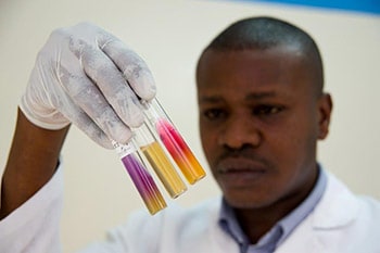 Scientist at work in Kenyan laboratory. Photo: David Snyder/CDC Foundation