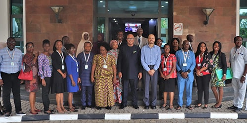 Dr. Chikwe Ihekweazu, NCDC’s Director General, and CDC’s Dr. Zahid Samad standing with public health managers after training at NCDC. Photo: Jeremiah Agenyi