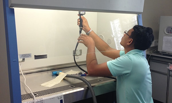 Testing for leaks on a high efficiency air filter of a biological safety cabinet. Photo: Anek Kaewpan