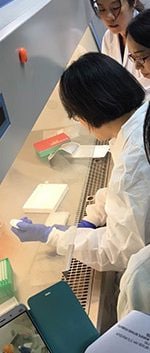 CHINA: Training on the AFI Taq Man Array card—by Liu Jie from UVA—in Guangzhou, Guangdong CDC. The card was used to test for multiple pathogens from blood samples collected from patients enrolled at each of the five AFI sentinel surveillance hospitals. Photo: Zhang Yuzhi