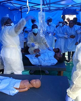 Hospital workers treat their "sick' patients during the exercise.