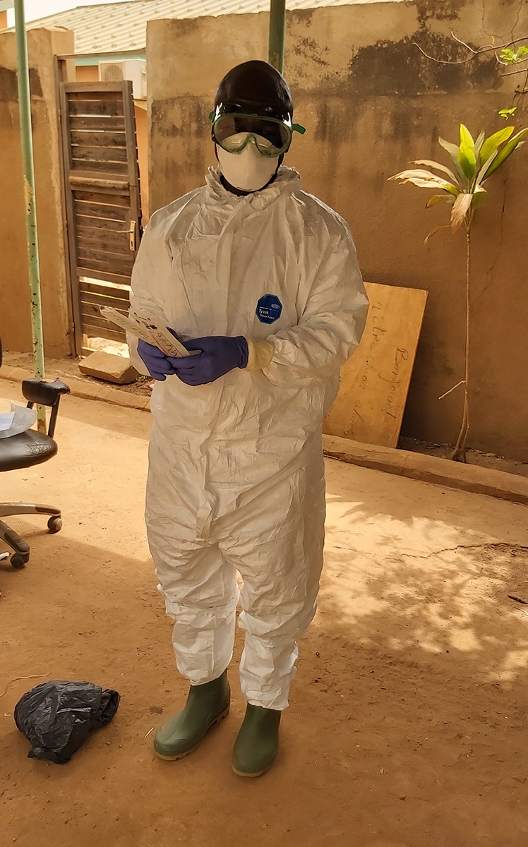 Collecting a COVID-19 specimen sample during the early stages of the outbreak in Burkina Faso. Photo: Emilie Thérèse Dama, CDC Burkina Faso