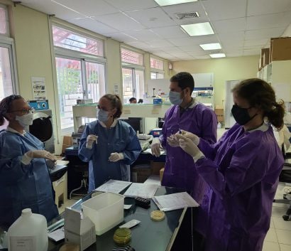 four people in a lab