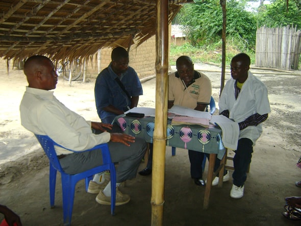 DRC National Expert Group on Immunization Data Quality Members conducting a data quality interview in Kasai Occidental. Photo courtesy of Daline Derival/CDC.