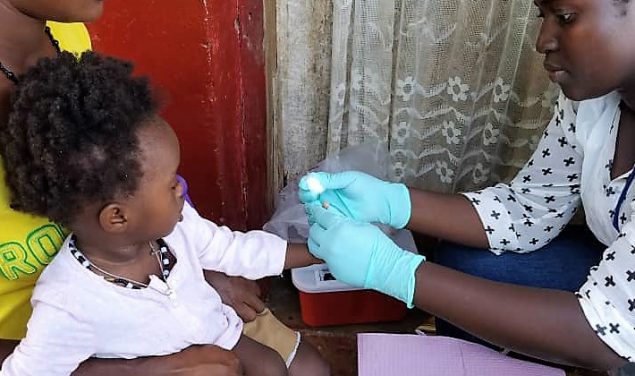Child being vaccinated Sierra Leone