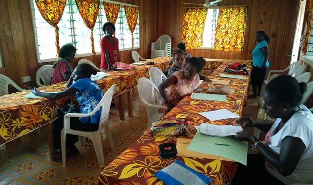 Immunization staff from different provinces in Solomon Islands reviewing their hepatitis B birth dose coverage data
