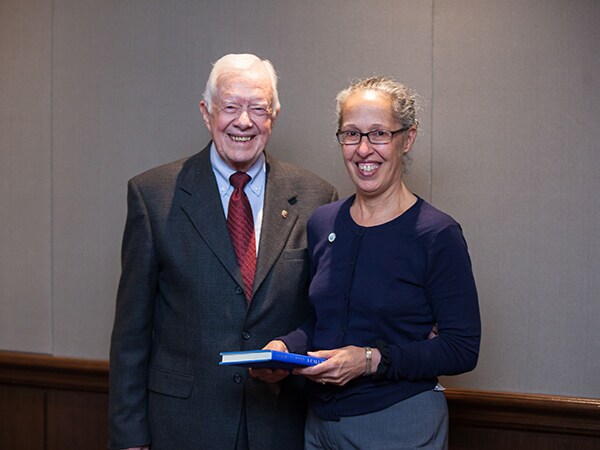Capt. Monica Parise, MD, Director of the Division of Parasitic Disease and Malaria with former President Jimmy Carter at a meeting of the Onchocerciasis Elimination Program of the Americas in Mexico, November 2014. Photo credit: The Carter Center.