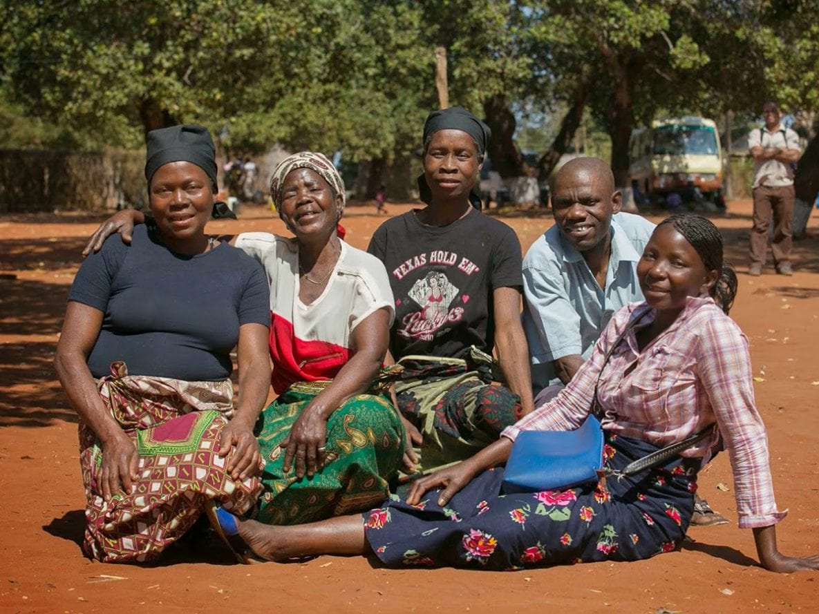 On a rotating basis, these members of a community support group in Mozambique collect and distribute HIV medications to each other, which helps them to maintain their treatment.