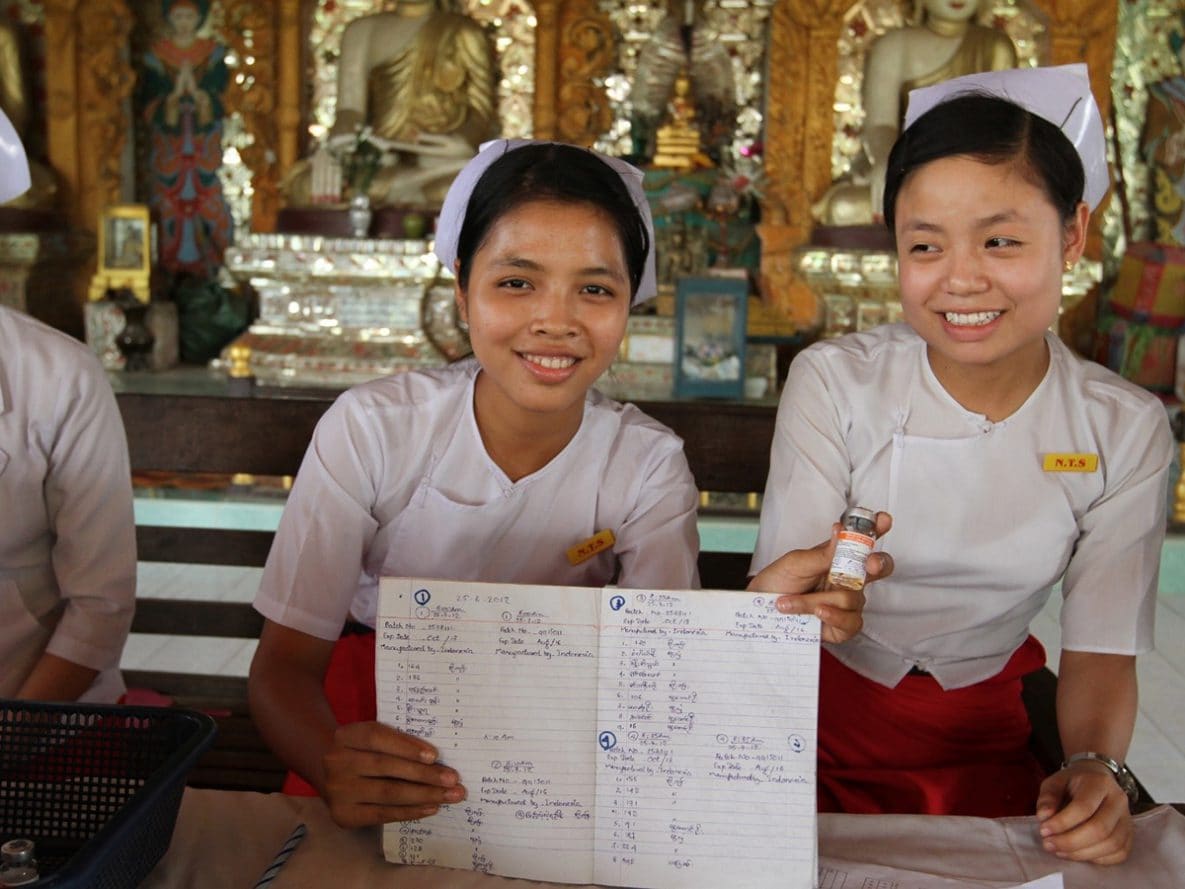 Nurses document their measles vaccination activities.