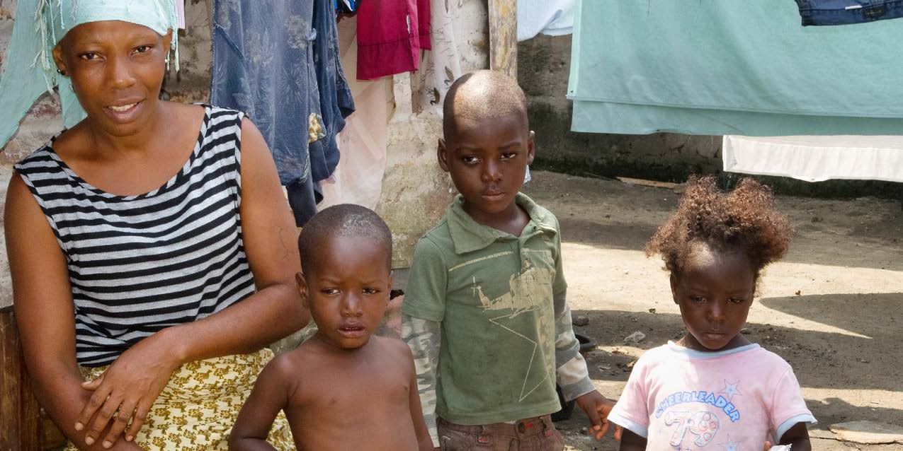 A mother and her three children in Liberia. Credit: Leslie R. McCree