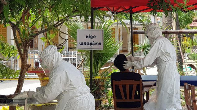 Battambang Hospital referral lab staff collecting samples for COVID-19 testing