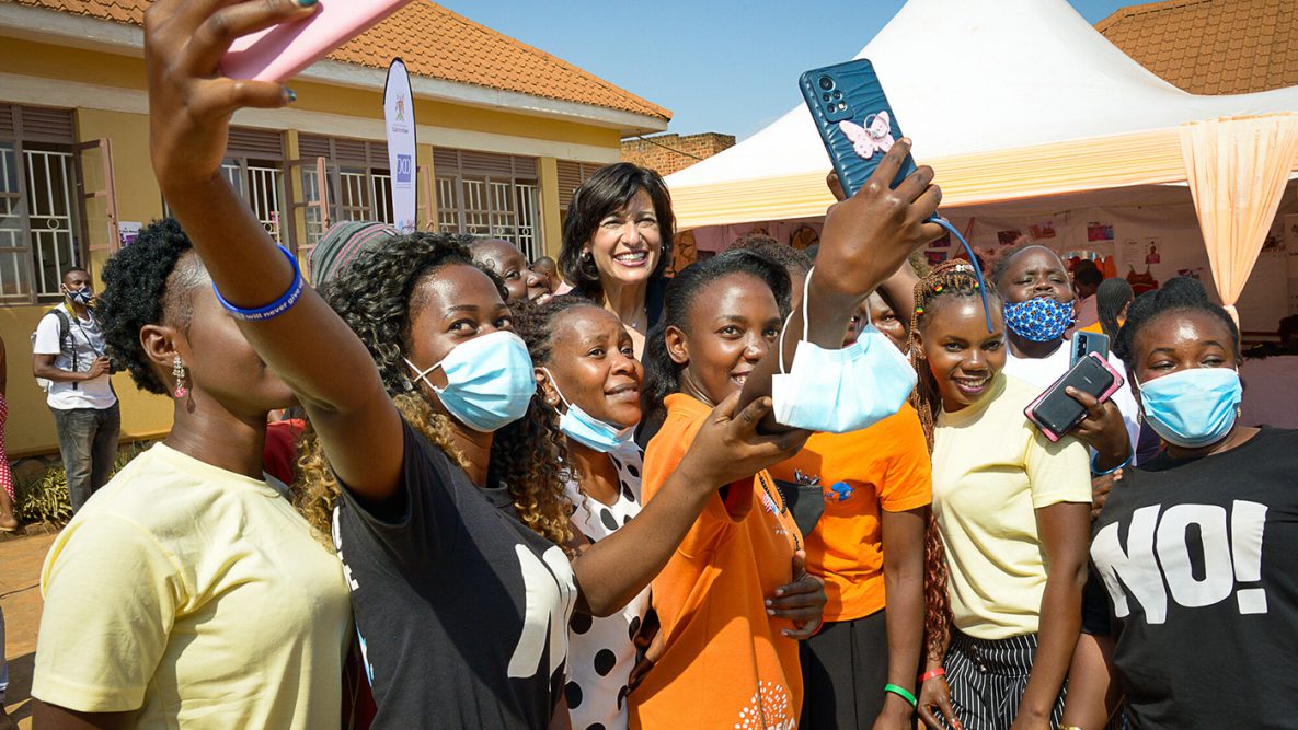 CDC Director Rochelle Walensky poses for a photo with program leaders at the Nsumbi Safe Space in Kampala, Uganda