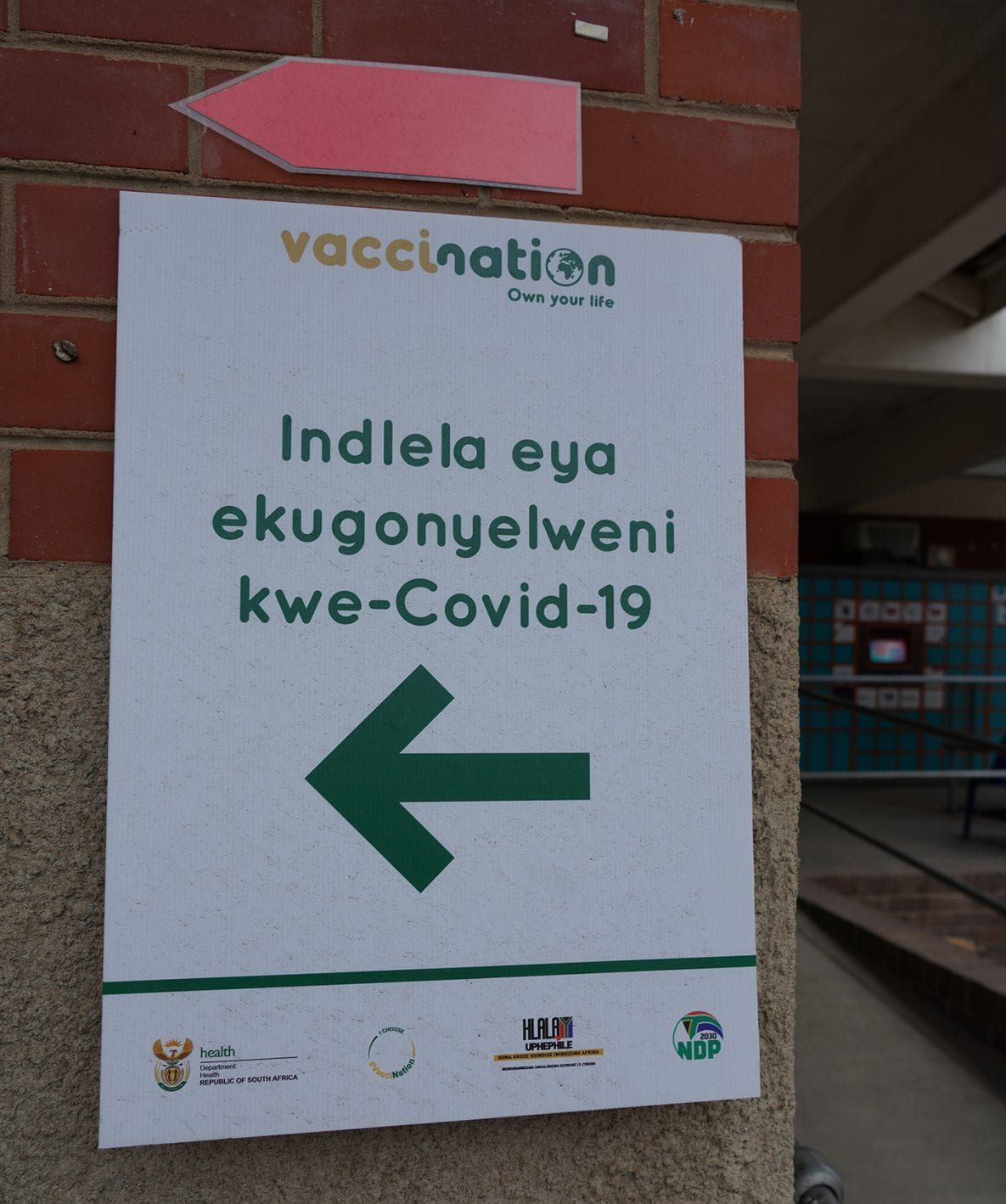 Photo of a sign showing where people in South Africa could get a COVID-19 vaccine.