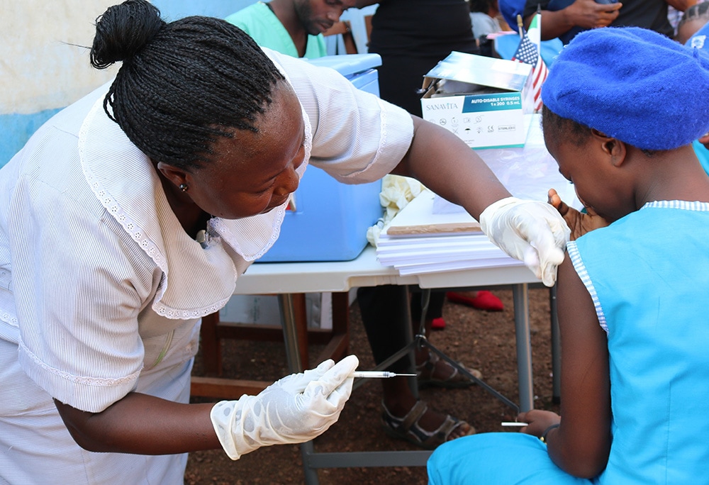 A health worker at a vaccination clinic offering COVID-19
