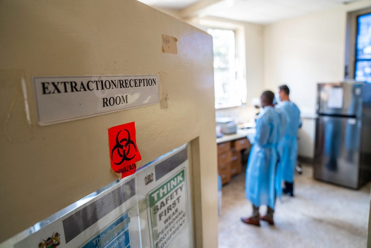 Photo of two laboratory workers inside the National Influenza Center Laboratory in Kenya.