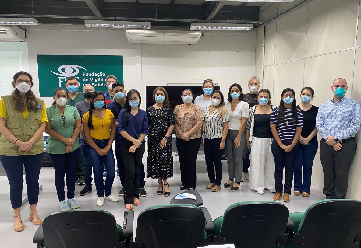 Photo of masked public health workers from Brazil and U.S. CDC working on the COVID-19 response in Brazil.