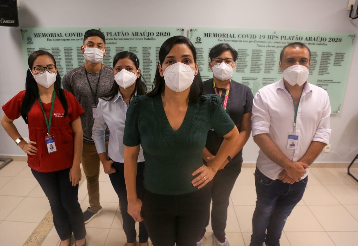 Photo of hospital workers, wearing masks, who investigated spread of Gamma Variant among healthcare