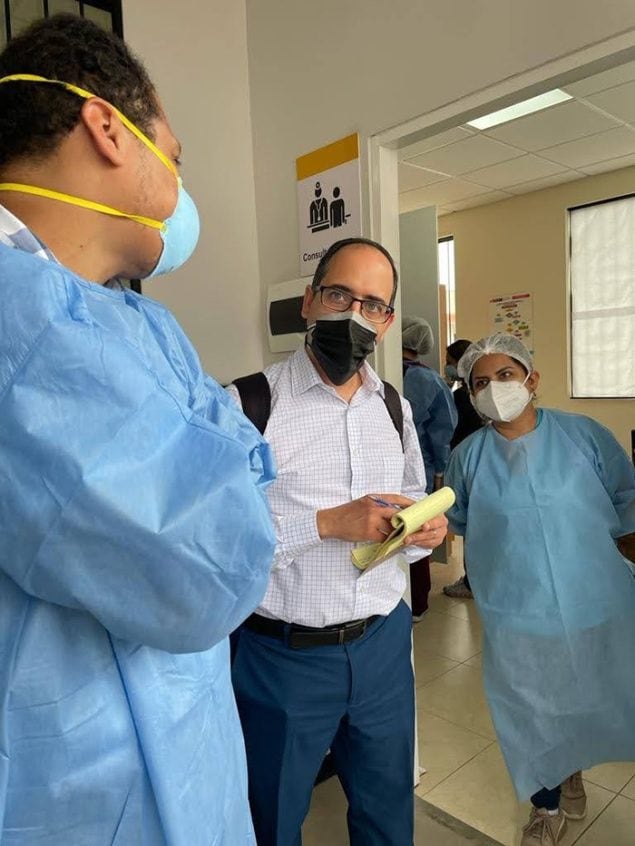U.S. CDC public health expert Nasim Farach meets with medical staff at a COVID-19 vaccination site in Honduras