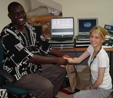Richard Omore, the GEMS Kenya study coordinator at KEMRI in Kisumu, Kenya, and Ciara O’Reilly, CDC Atlanta epidemiologist in the Waterborne Diseases Prevention Branch, celebrate getting a search engine for randomization of controls in the GEMS case-control study up and running and loaded on laptops for each of the GEMS clinics. The computers were donated by the CDC Atlanta excess old supplies unit.