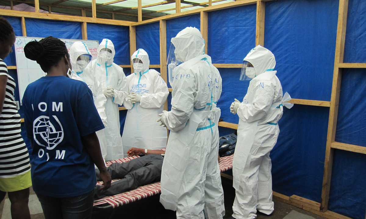 CDC collaborates with partners that conduct IPC training at the National Ebola Training Academy in Freetown, Sierra Leone. Above, the International Organization of Migration (IOM) staff are shown training frontline responders through simulation exercises. Patients for simulation exercises are Ebola survivors.