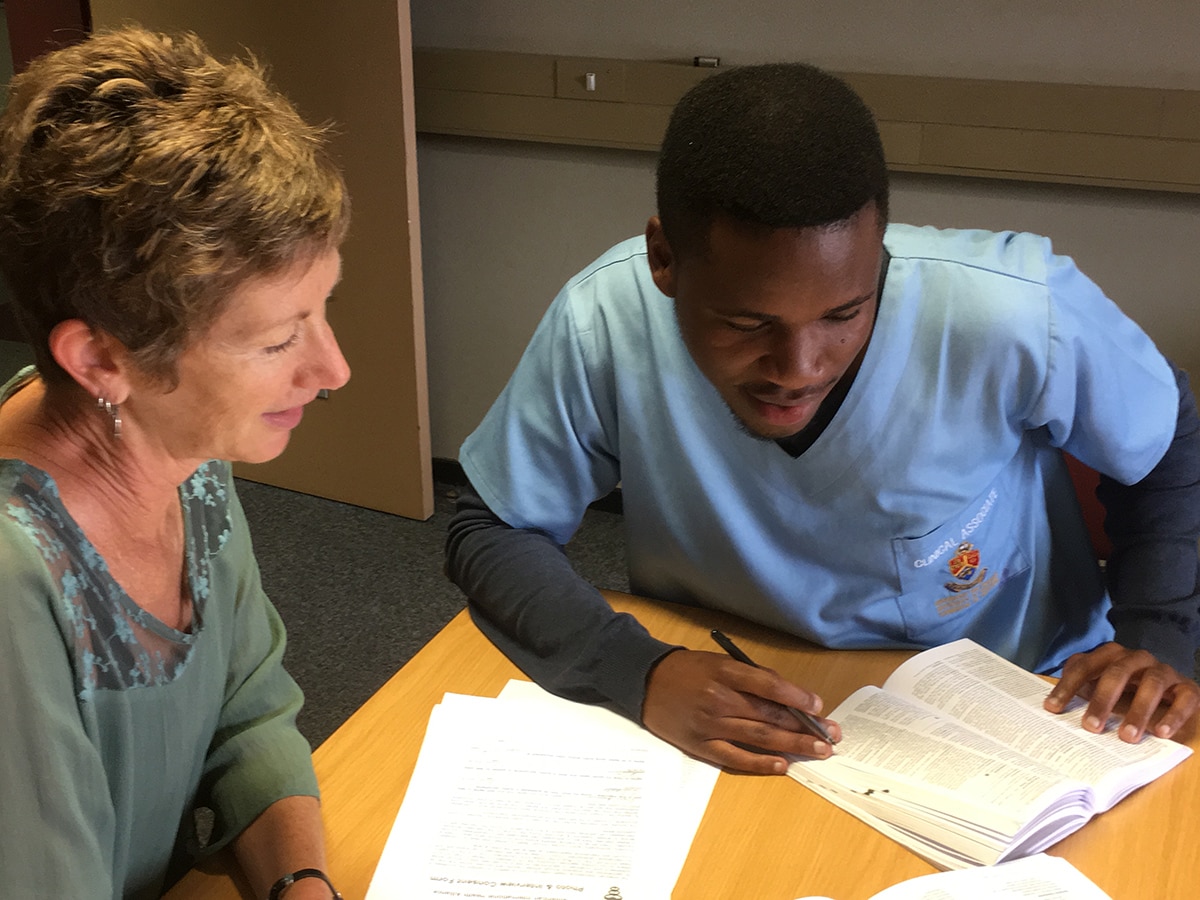 Julie Himstedt works with student Phuti Moloto