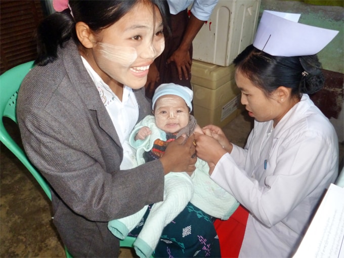 Health care provider with an infant and mother