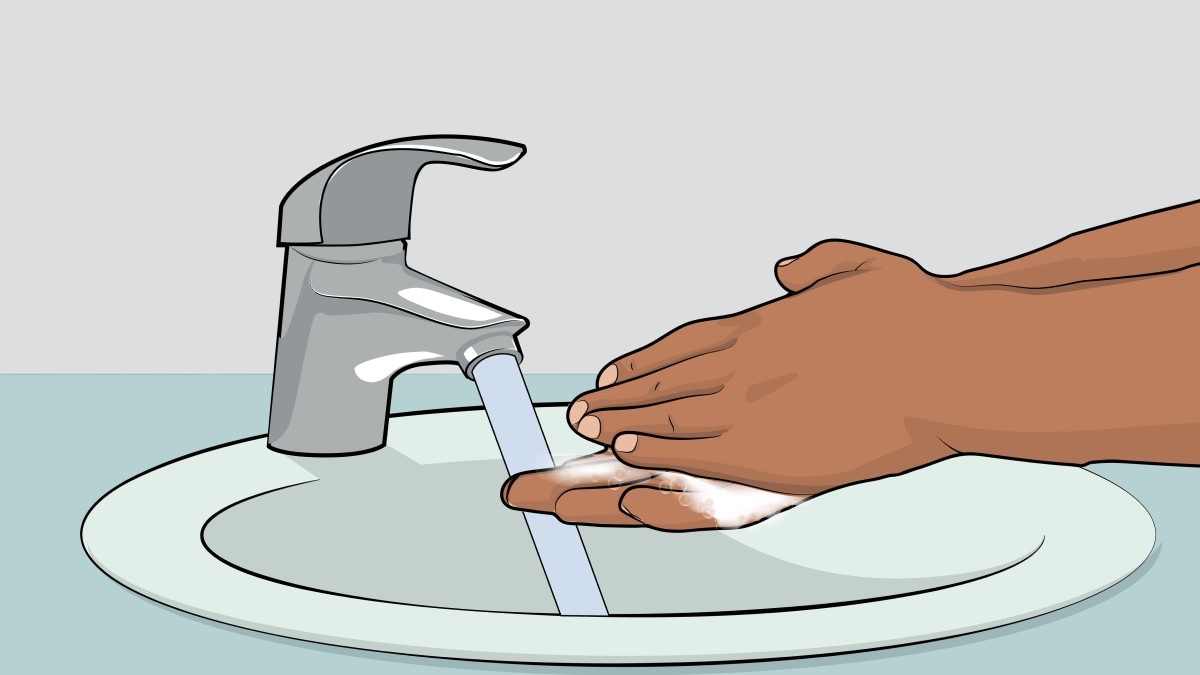 Illustration of a person washing their hands with soap and water.