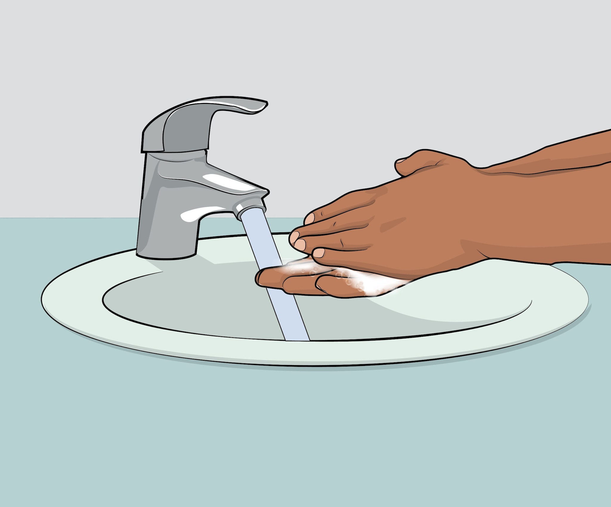 Una persona lavándose las manos con agua y jabón.