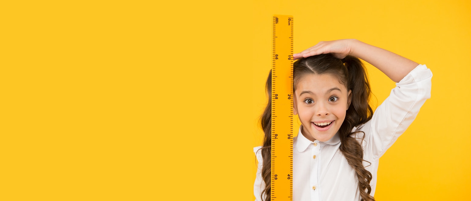 Image of girl with measuring stick