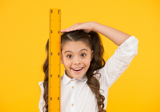 girl with measuring stick
