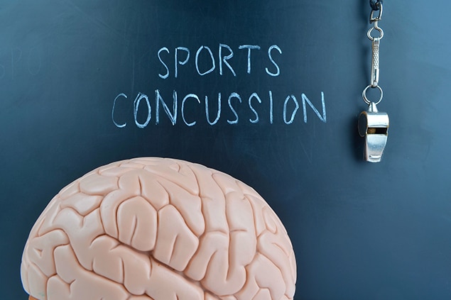 chalkboard with whistle and brain - sports concussion