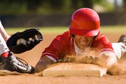 photo: baseball player sliding into base