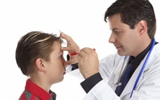 Doctor examining boy