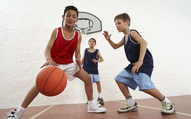 Photo: Young boys playing basketball
