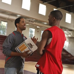 photo: coach talking to basketball player