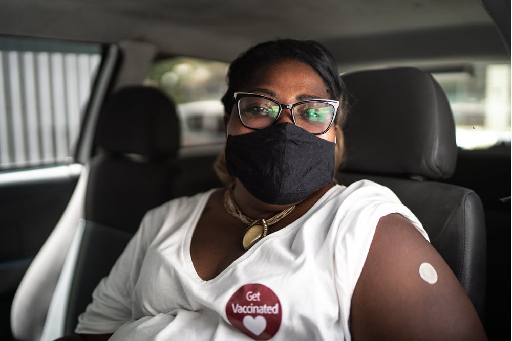 Black woman vaccinated wearing mask