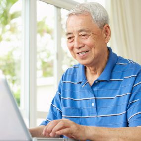 Senior man using laptop computer