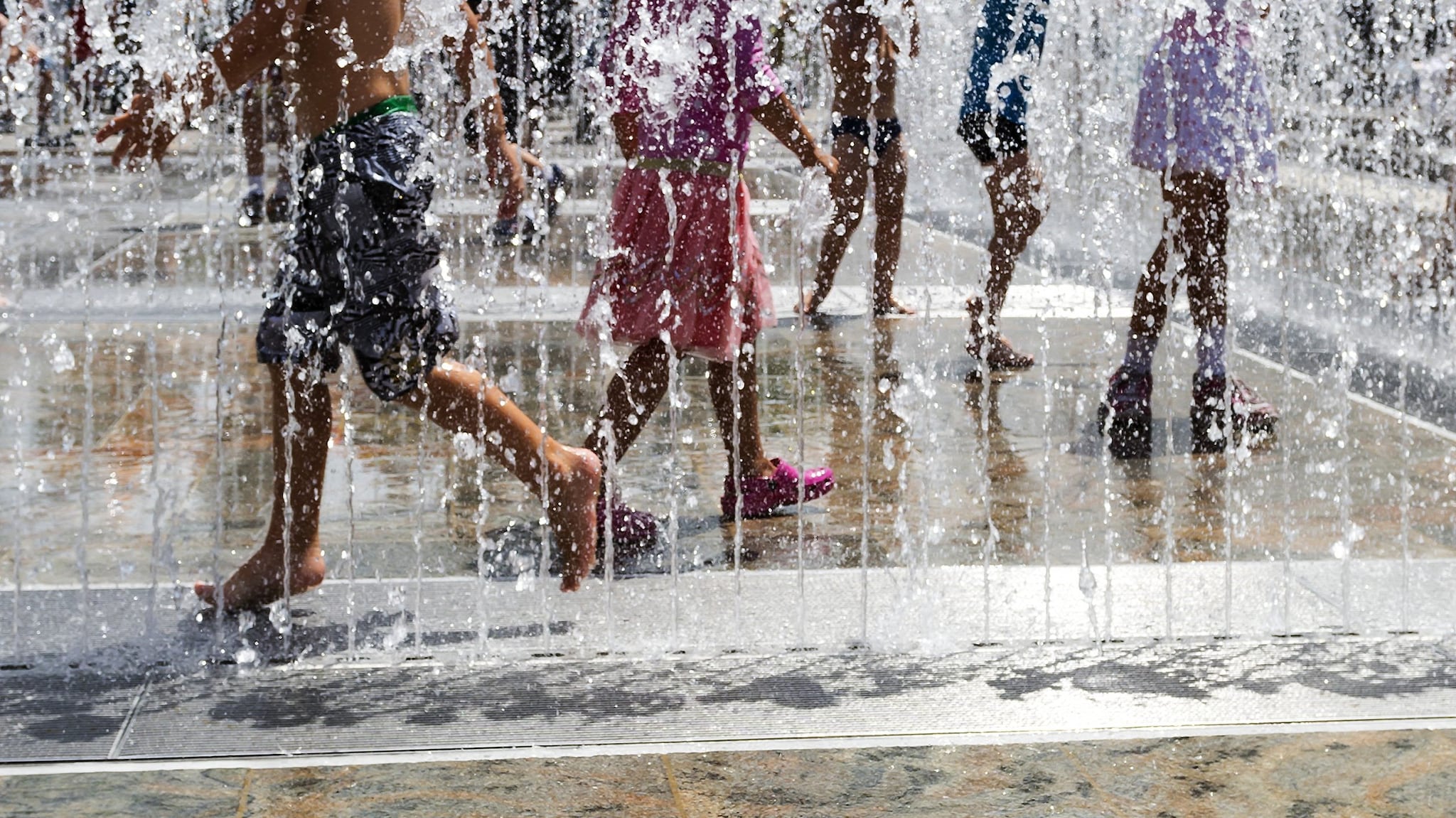 Children playing in a splash fountain