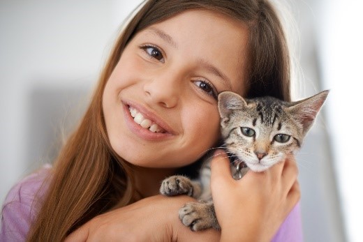 A girl with her kitten