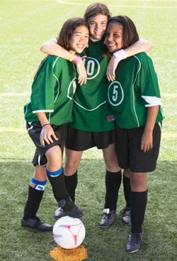 Three girl soccer players