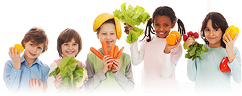 group of children holding vegetables