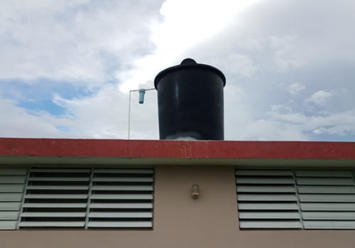 Rooftop cisterns that collect treated water from public water systems are common in Puerto Rico.