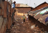 Boy standing in a slum in Kenya