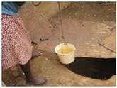 Image of Haitian women with water bucket