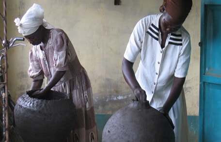 Women with washing pots