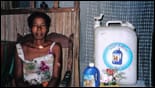 A woman with a Safe Water System