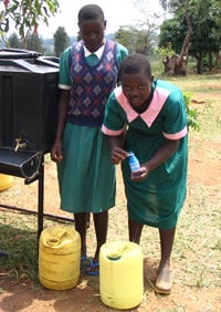 Photo: Children treating water